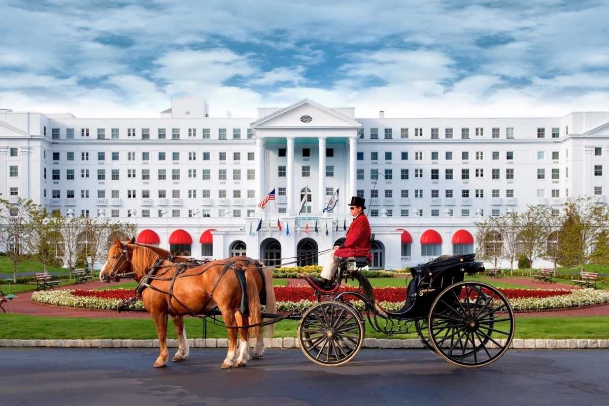 The Greenbrier Resort in White Sulphur Springs, WV with horse-drawn carriage in front